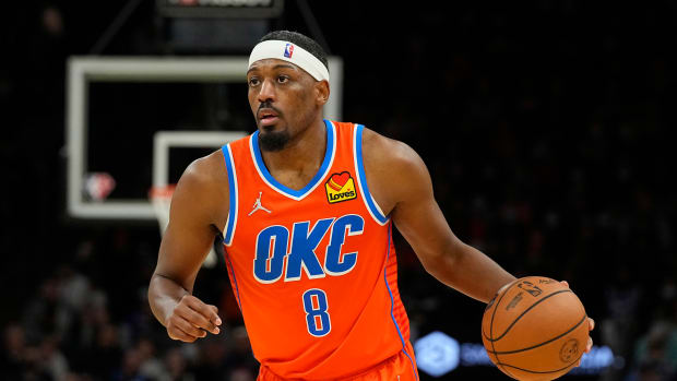 Oklahoma City Thunder guard Paul Watson (8) dribbles the ball against the Phoenix Suns in the second half at Footprint Center.